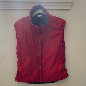 Nike Red perforated Puffer Vest with side adjustment lacing.